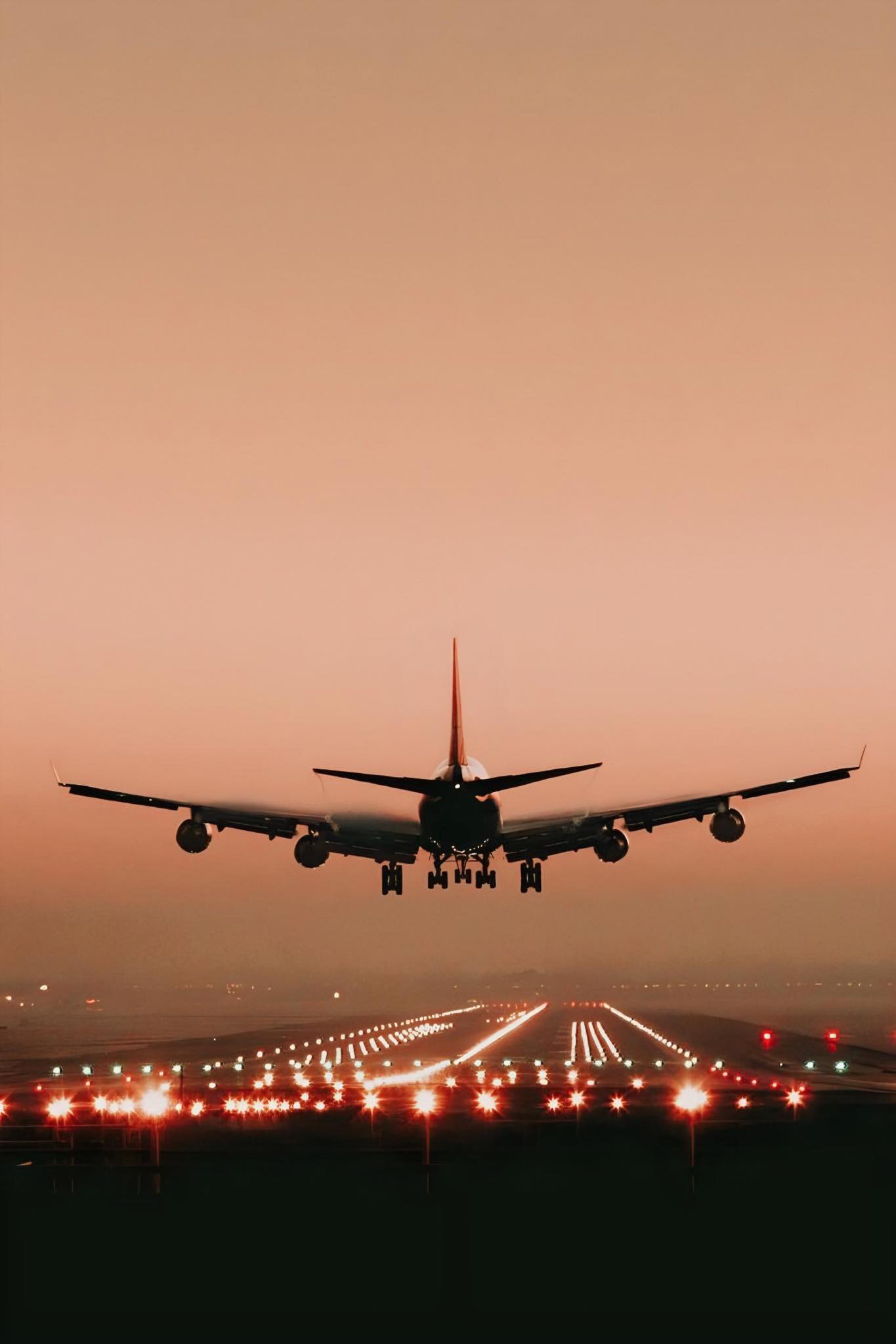 Aircraft Landing at Sunset